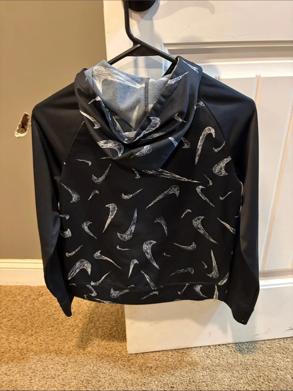 Nike Black Hoodie with White Swoosh Pattern